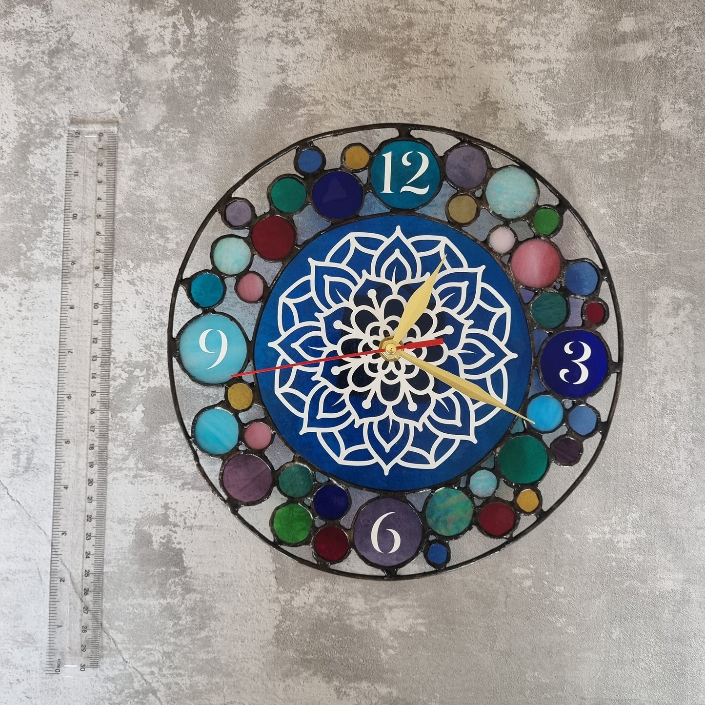 Handmade stained glass clock – close up of glass panels