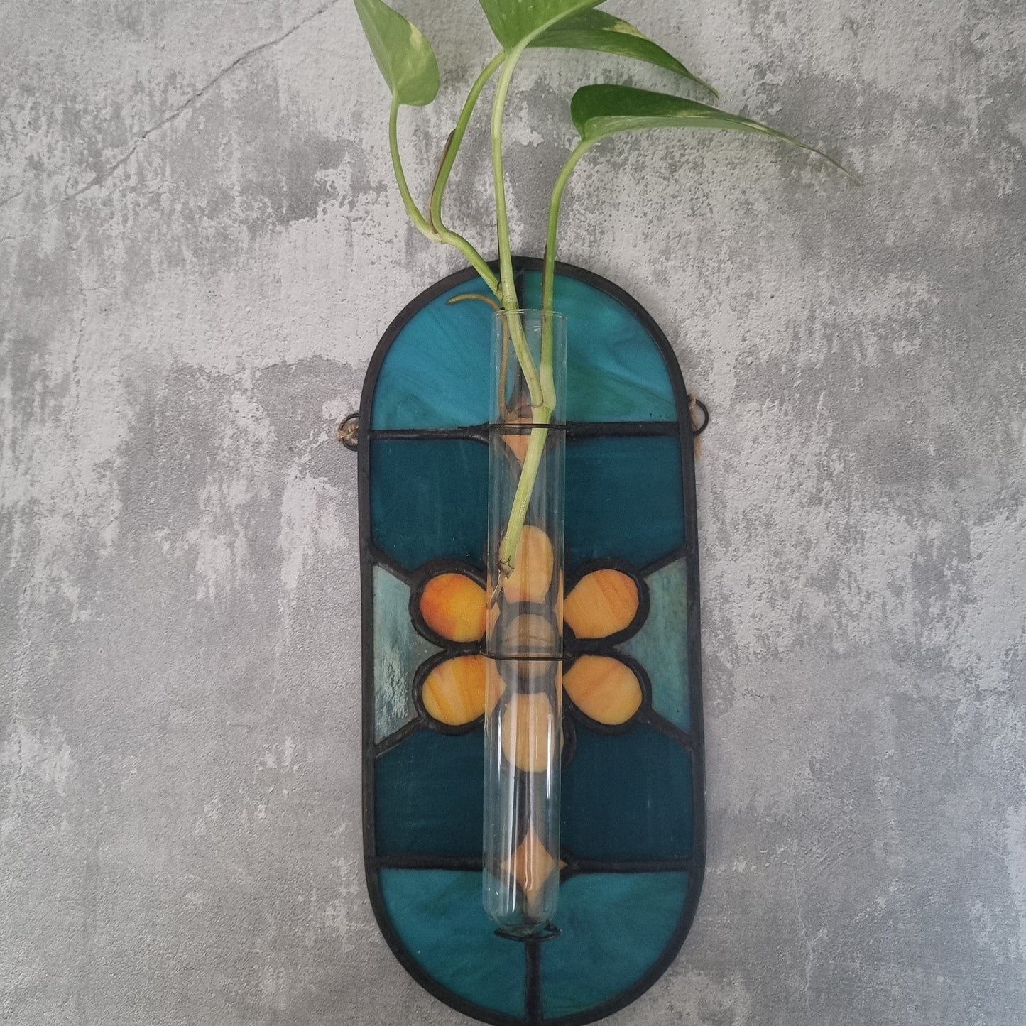 Stained glass wall planter – front view showing colorful glass panels