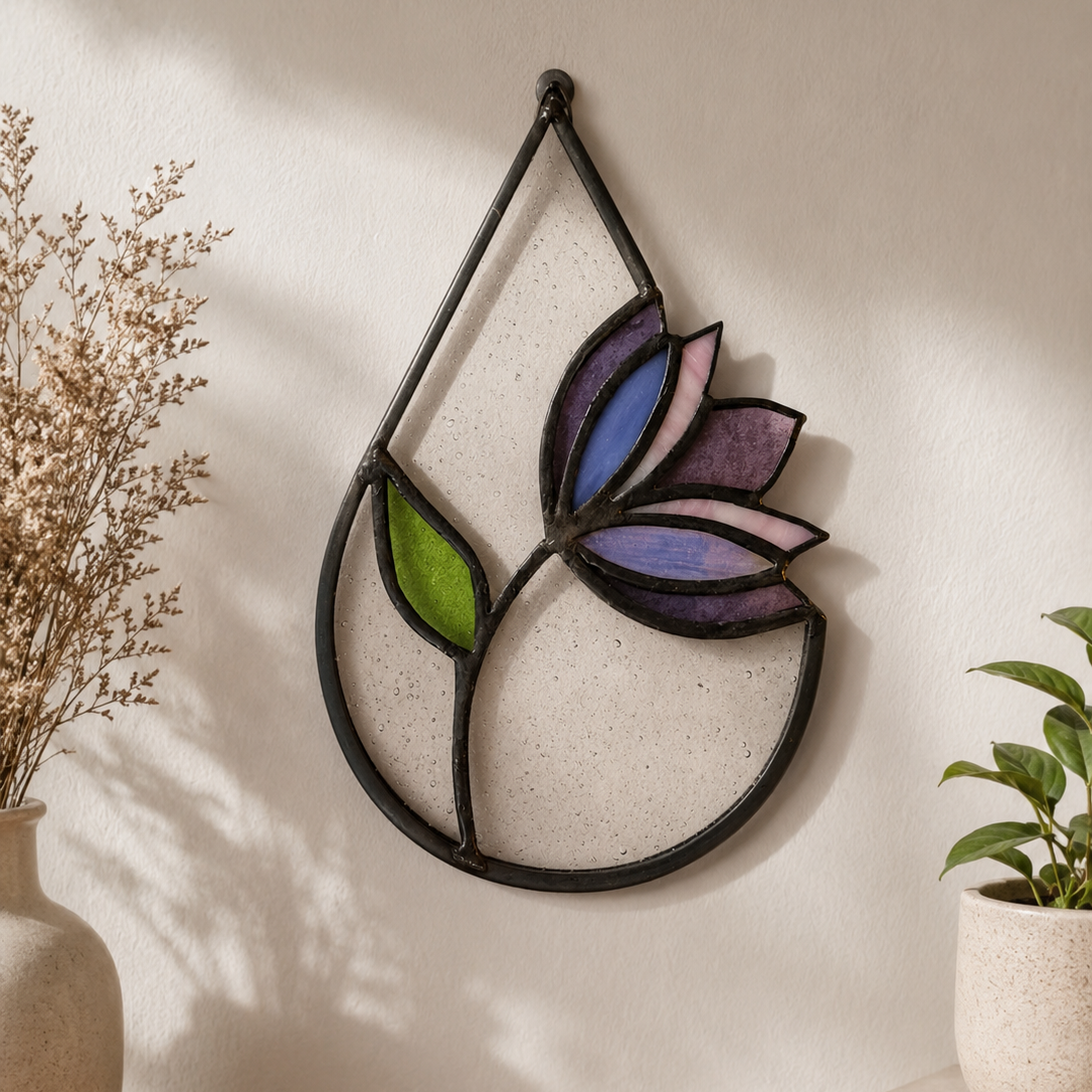 Decorative wall art with a colorful leaf design on a plain wall.