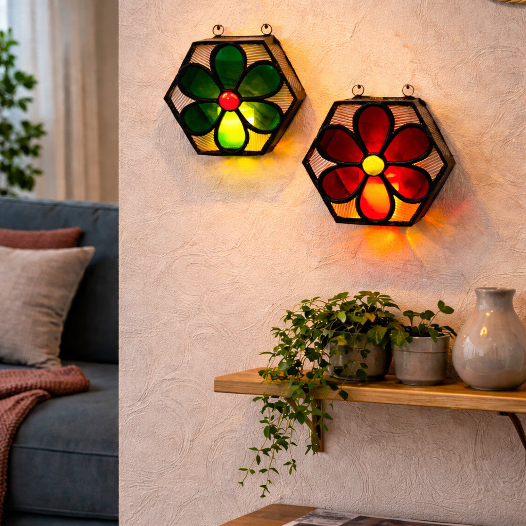 Decorative wall lights with floral designs in a living room setting.