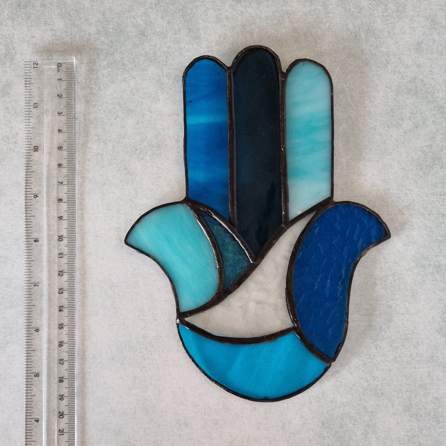 Blue stained glass Hamsa – hung on wall