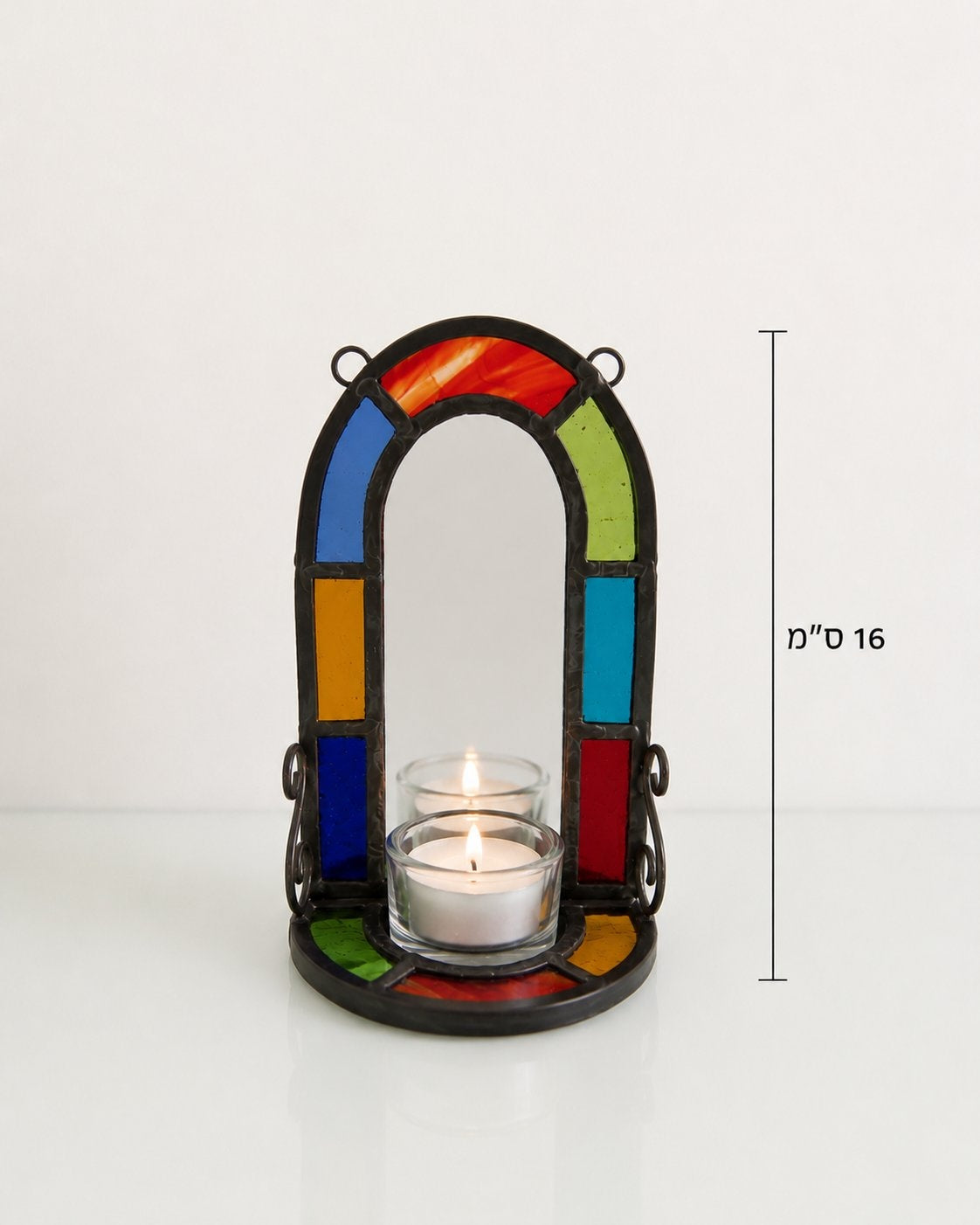 Colorful stained glass lantern with a lit candle on a white background