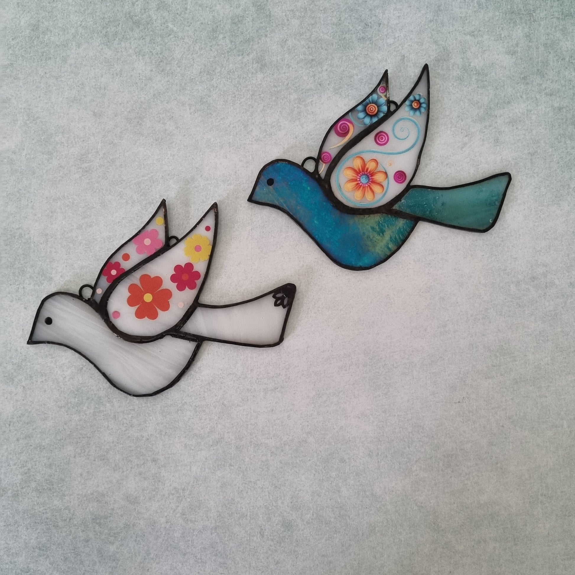 Colorful handmade glass bird – side view
