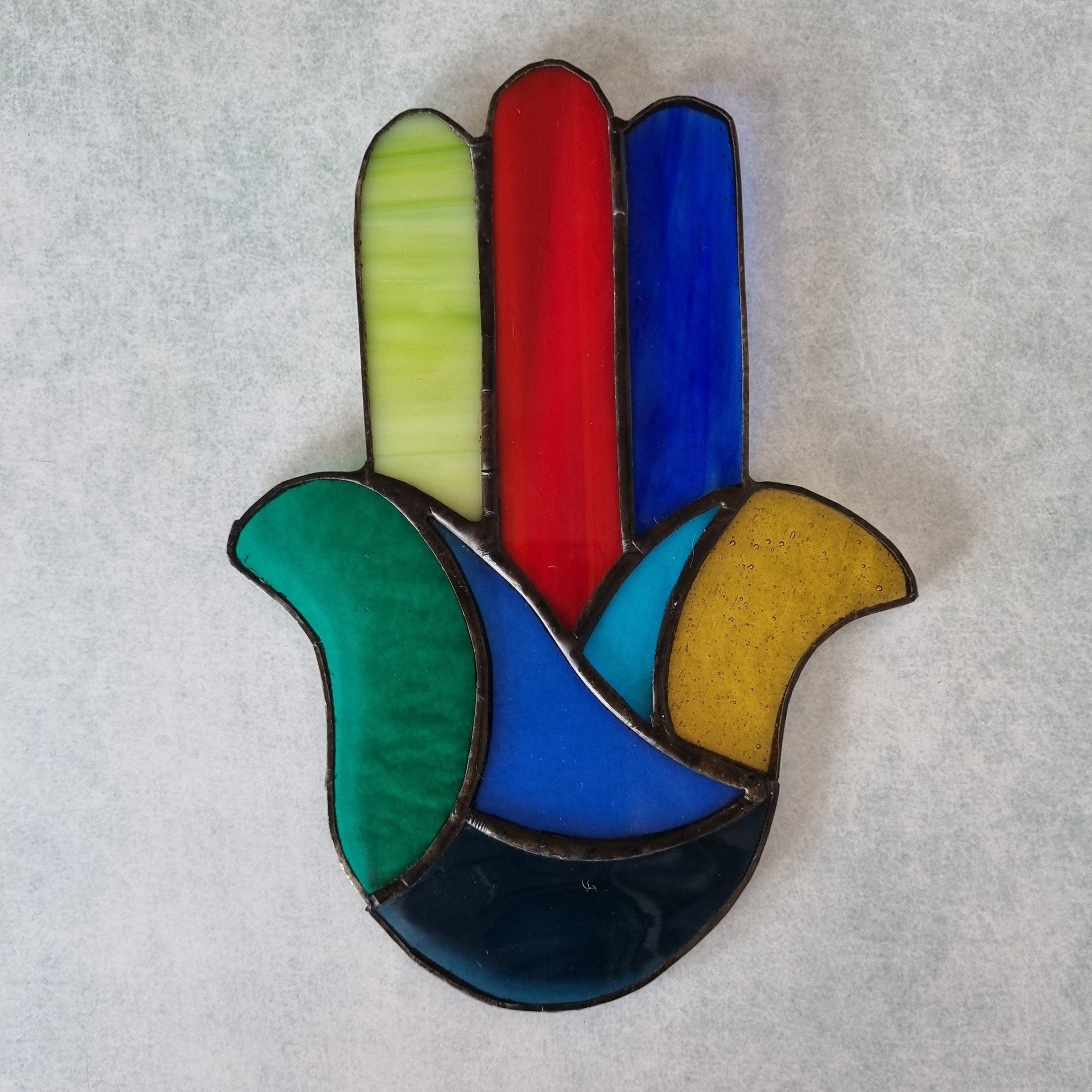 Colorful stained glass Hamsa – side view showing glass colors