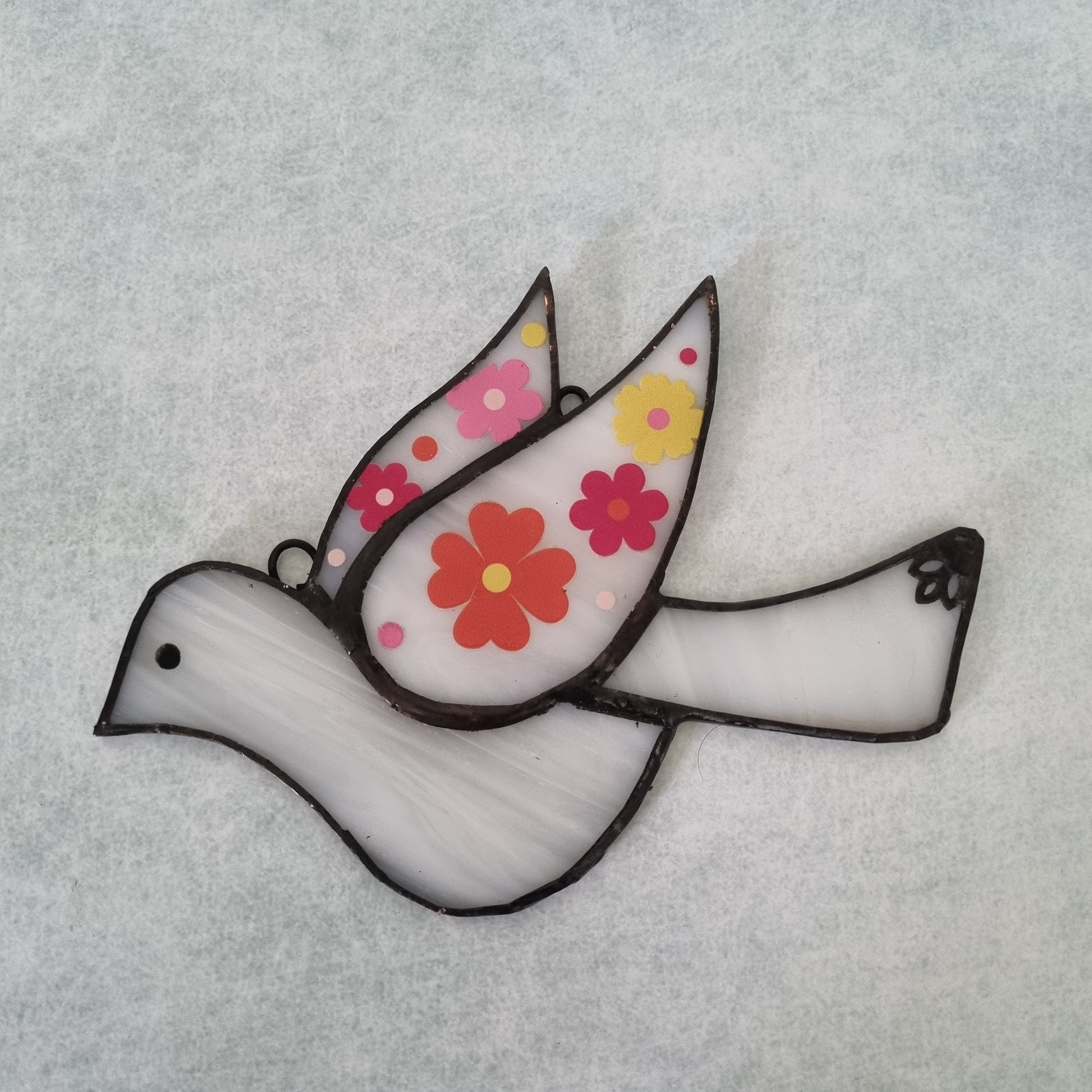 Glass bird decoration – close up detail of colors