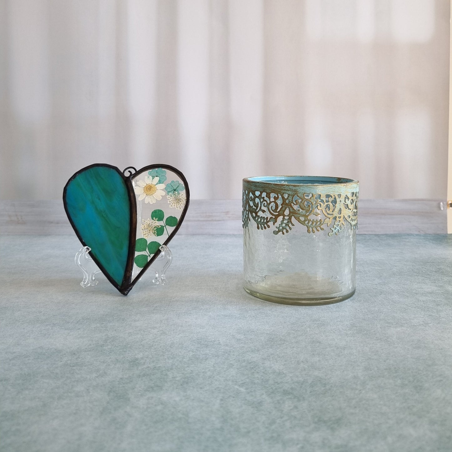 Glass heart with dried green flowers – side view