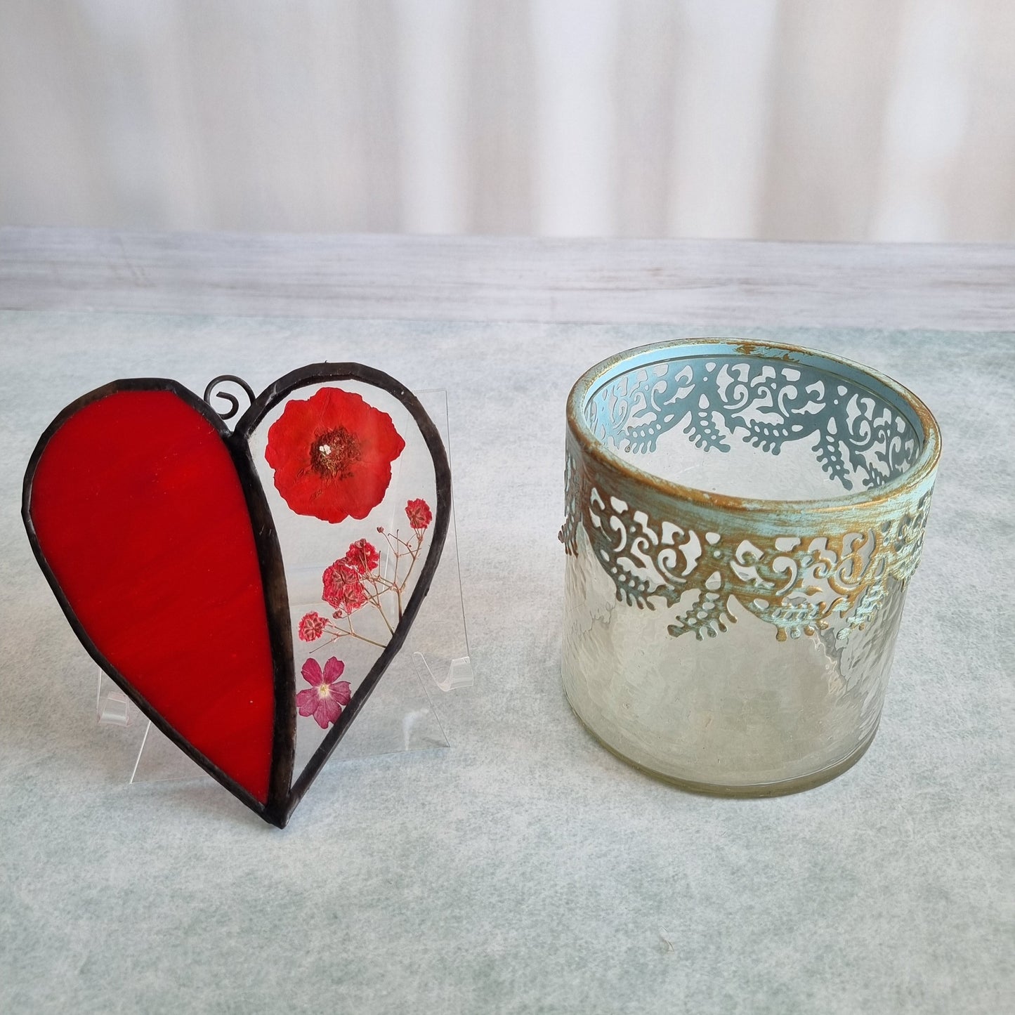 Glass heart with dried red flowers – side view