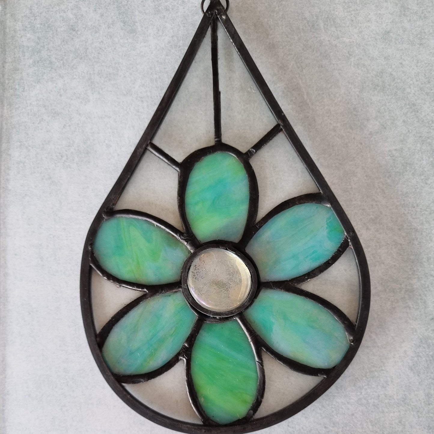 Green flower teardrop stained glass – close up