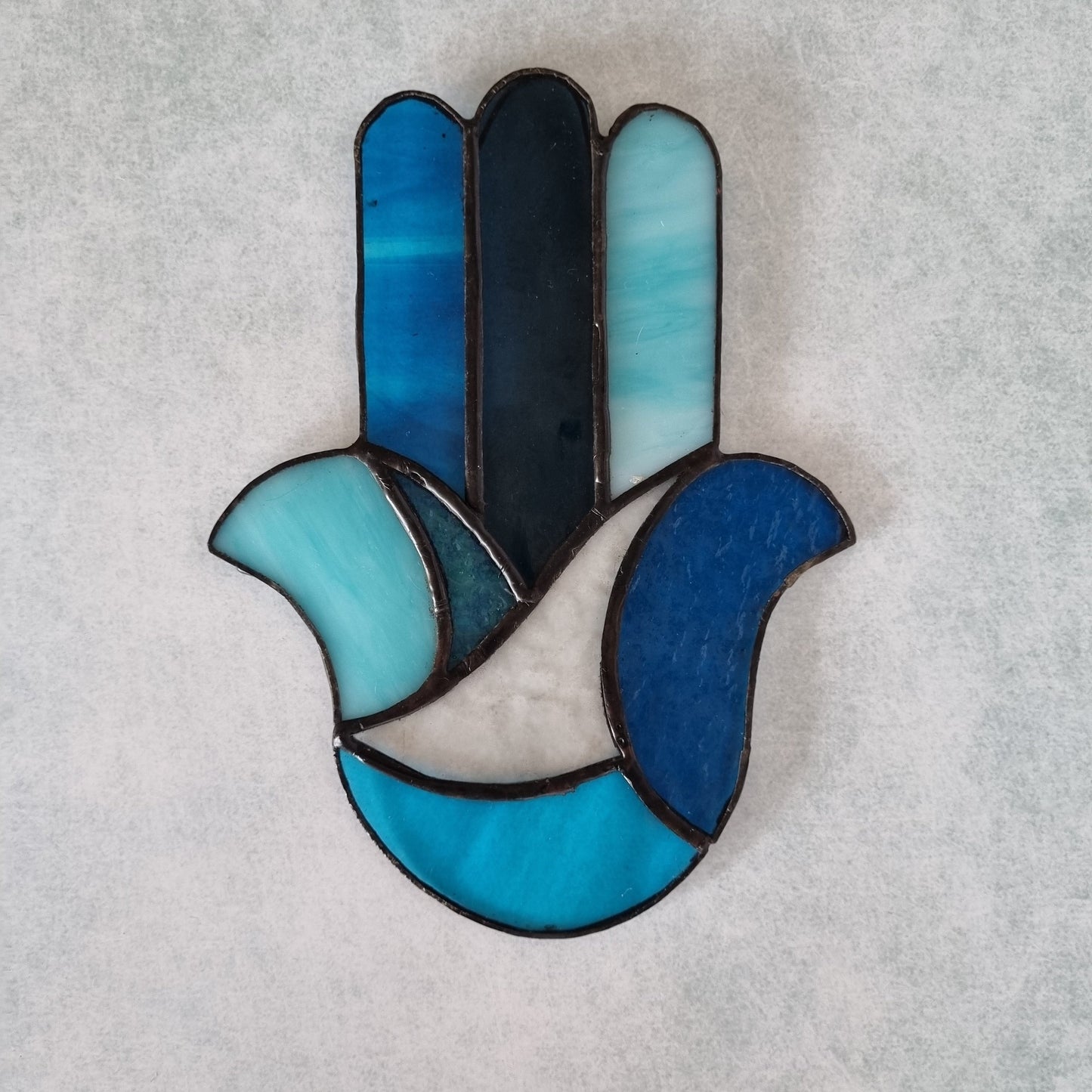Handmade blue Hamsa glass wall art – close up