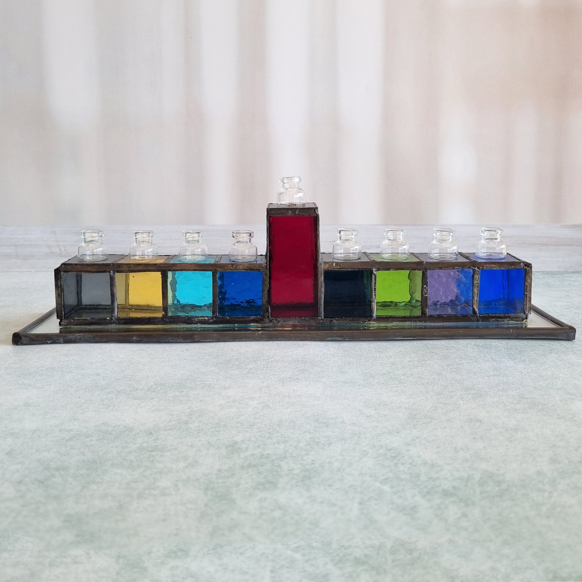 Colorful handmade stained glass Hanukkah menorah – each arm a different color