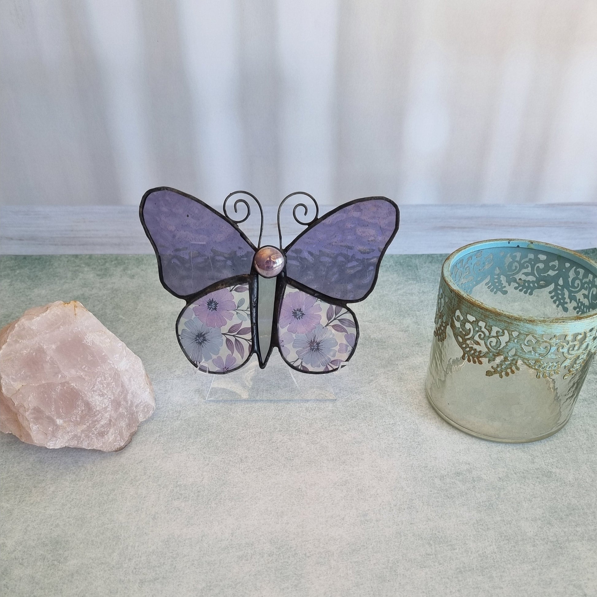 Handmade purple glass butterfly – close up flower detail