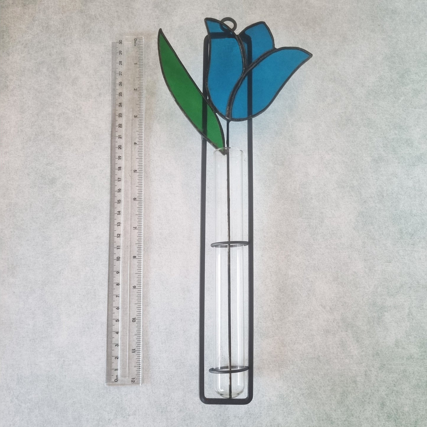 Handmade stained glass wall decoration with blue tulip – front view