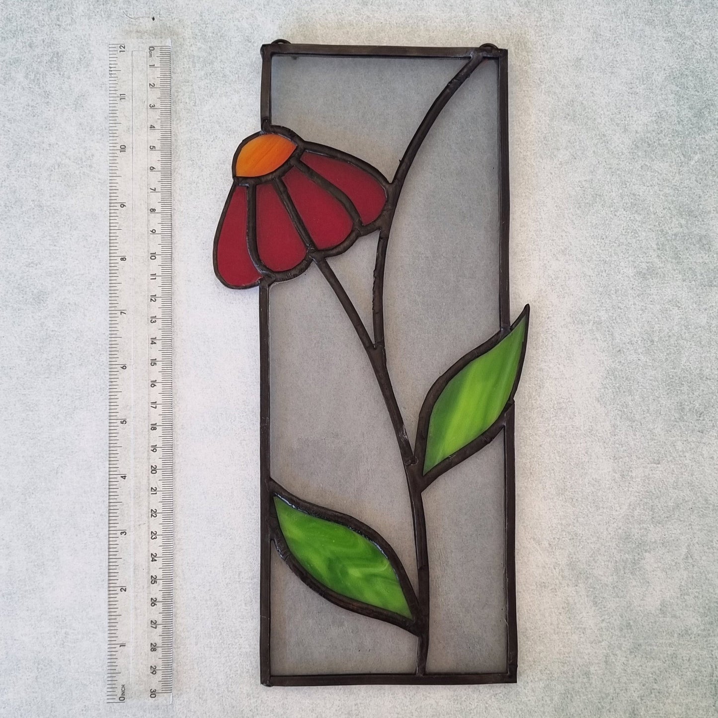 Handmade stained glass picture with decorative red flower – front view