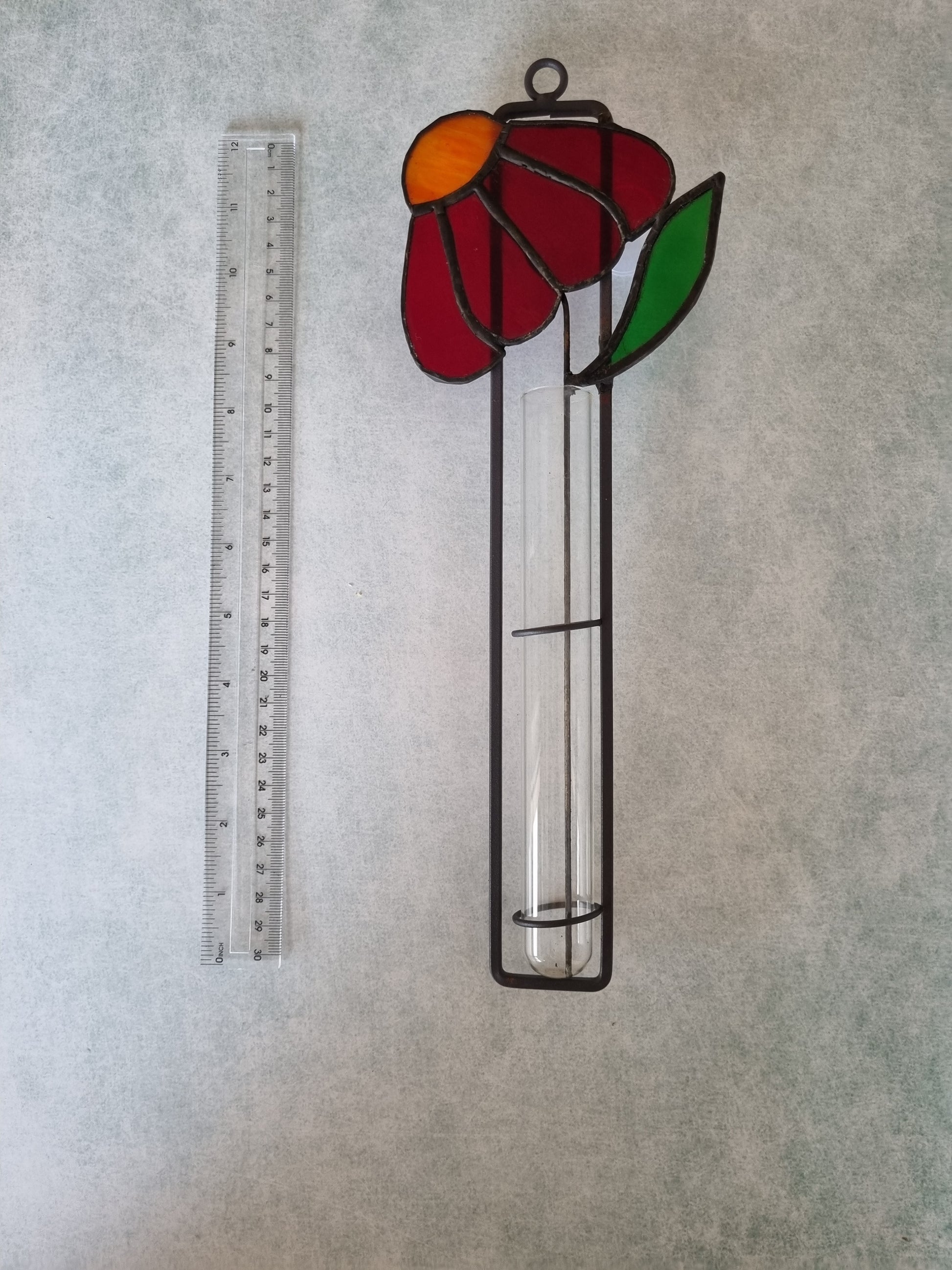 Handmade stained glass red flower decoration – close up detail
