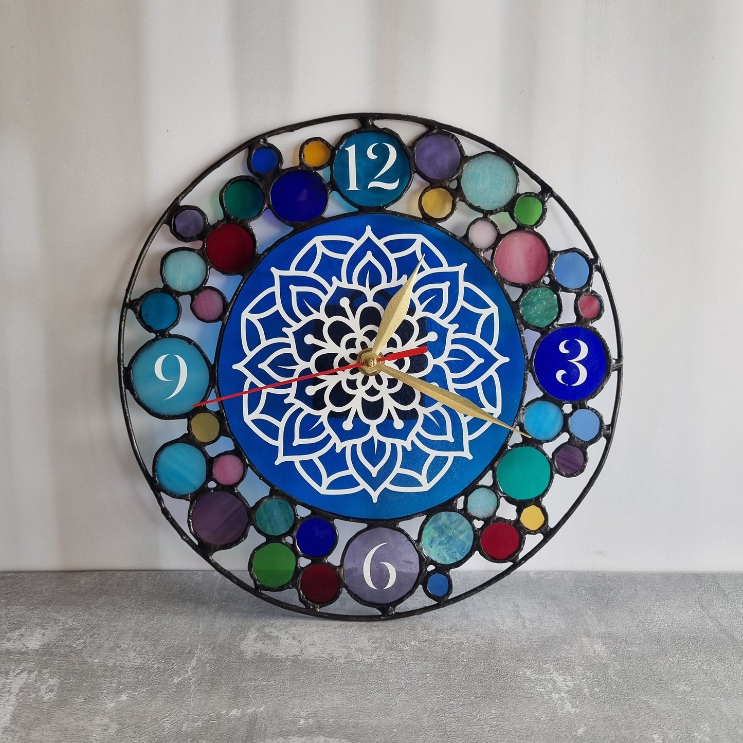 Handmade stained glass wall clock – front view showing all colors