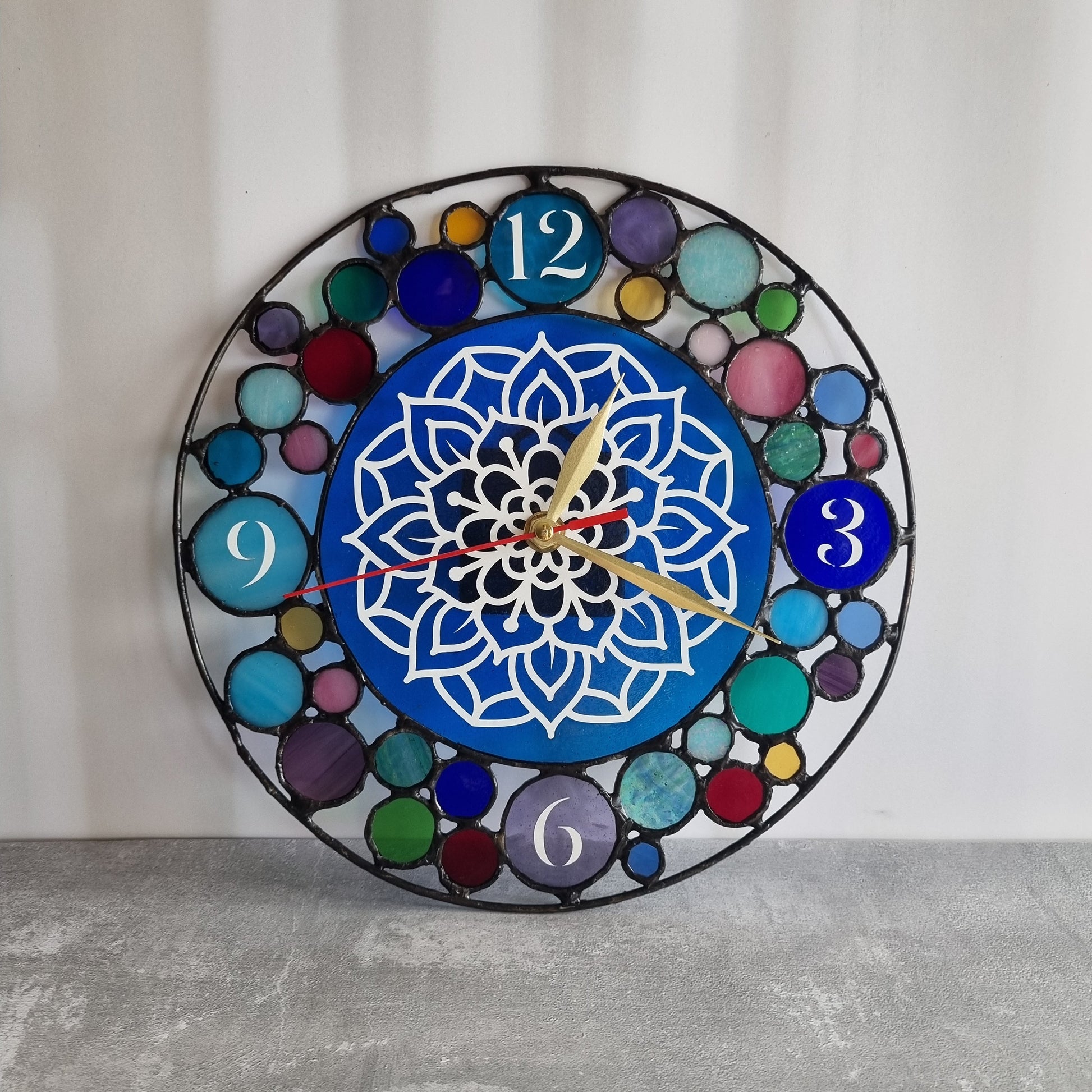 Handmade stained glass wall clock – front view showing all colors