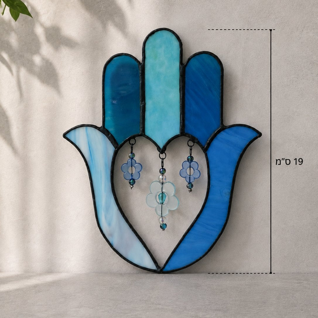 Decorative stained glass Hamsa hand with blue and green colors on a light gray background.