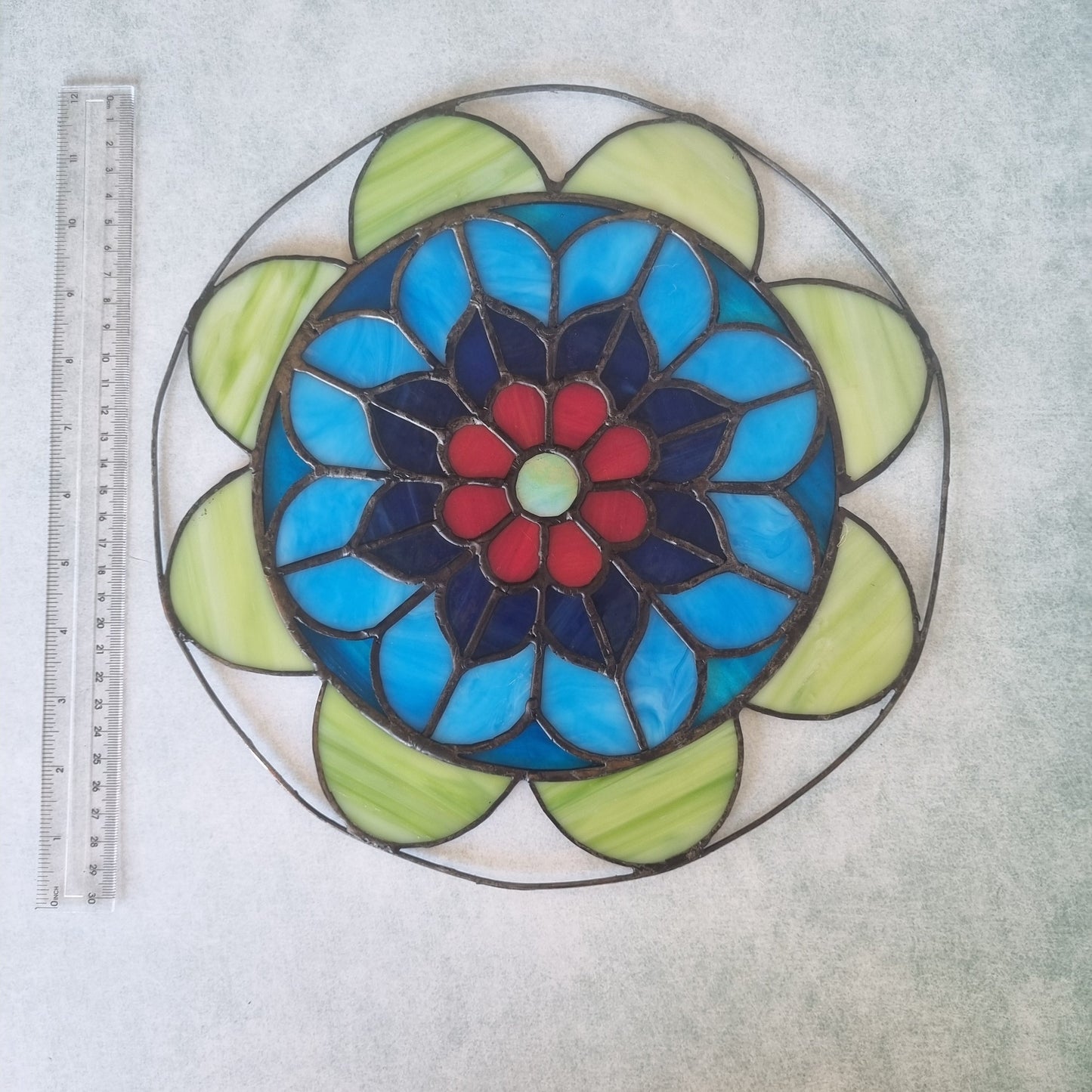 Stained glass mandala – light effect through colored glass panels