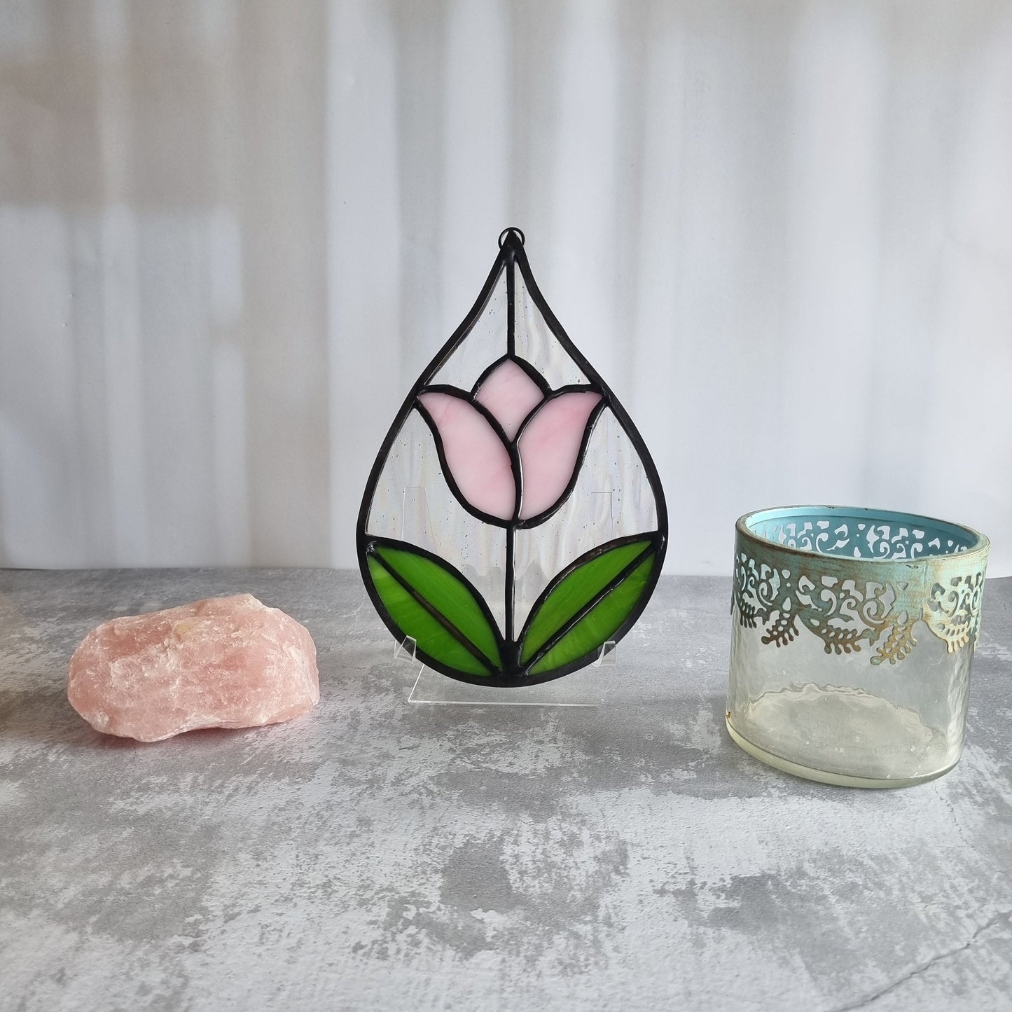 Handmade stained glass pink tulip suncatcher on window